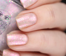 nail polish by crystal knockout, angel aura shock, sheer white with pink glow and iridescent flakes