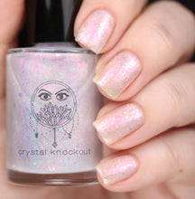 nail polish by crystal knockout, angel aura shock, sheer white with pink glow and iridescent flakes