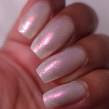 nail polish by crystal knockout, angel aura shock, sheer white with pink glow and iridescent flakes